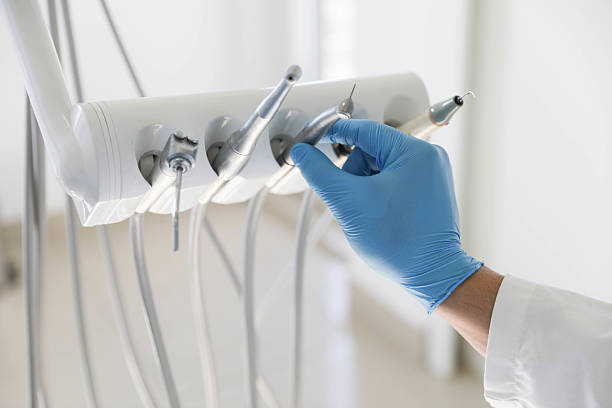 Professional Tooth Extraction technician working in Ionia County County, MI